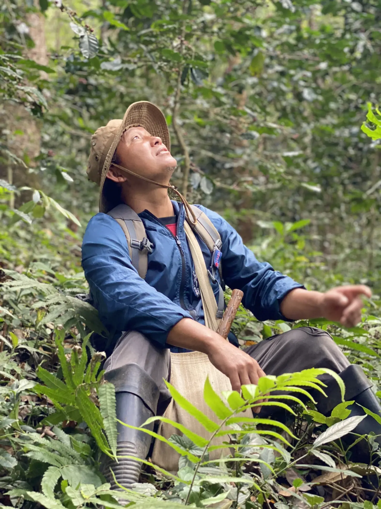 Manop sitting in the mountain forest of Mae Hong Son